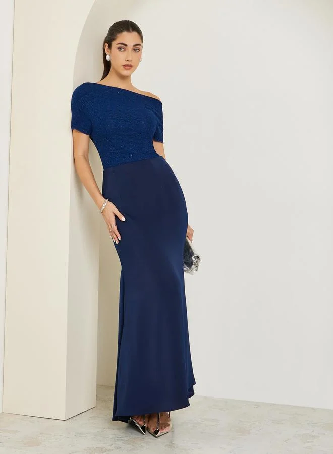 ستايلي بلوزة محبوكة بياقة غير متماثلة